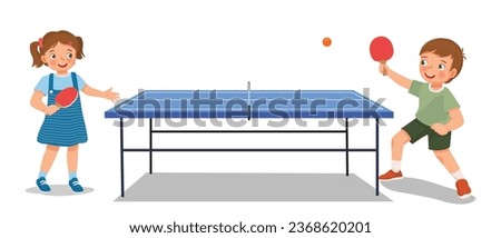 Cute little kids boy and girl playing table tennis ping pong together