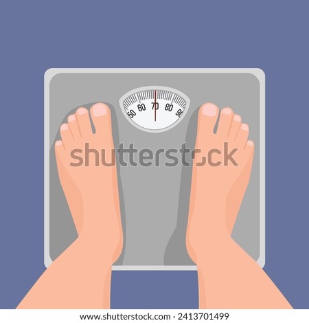 Top view of male feet standing on weighing scale