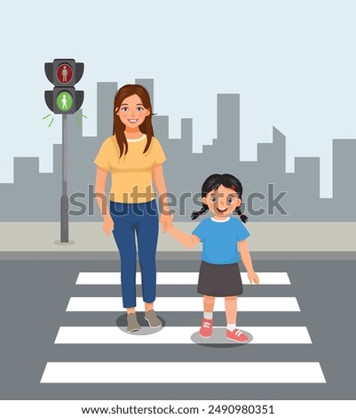 Cute little girl and her mother crossing the road on zebra crossing