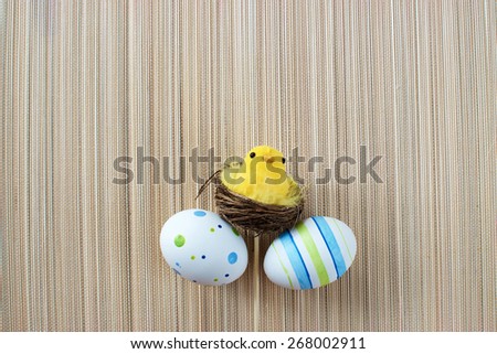 Yellow chick with eggs