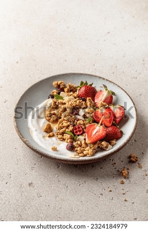 Similar – Image, Stock Photo A muesli with yoghurt and fresh fruit in a preserving jar on the breakfast table