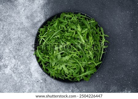 Similar – Foto Bild Frische Rucola-Blätter in einem Strauß auf grünem Tisch. Rucola-Bündel