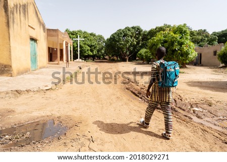 Similar – Image, Stock Photo Lonely kid walking on a road. Aerial view