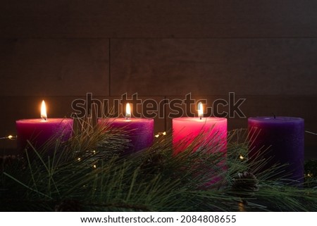 Similar – Image, Stock Photo advent wreath with burning red candles standing on wooden table in living room with candle arch in window