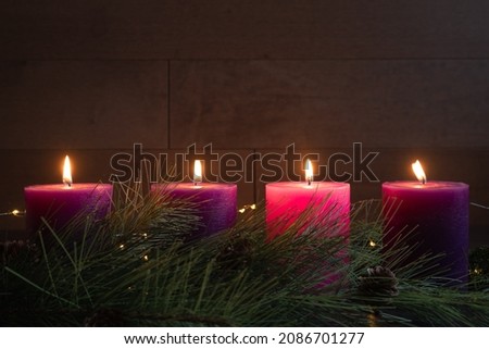 Similar – Image, Stock Photo advent wreath with burning red candles standing on wooden table in living room with candle arch in window