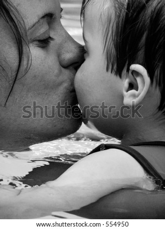Mother kissing infant