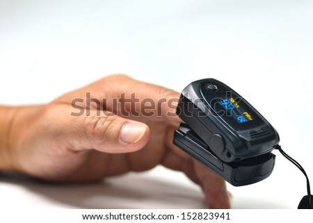 Similar – Finger with pulse oximeter