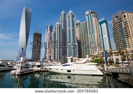 DUBAI - NOVEMBER 16: Dubai Marina skyline. Dubai Marina skyscrapers, Cayan Tower, Princess Tower, The Torch Tower on November 16, 2014 in Dubai