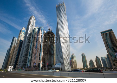 DUBAI - NOVEMBER 16: Dubai Marina skyline. Dubai Marina cityscape. Dubai Marina skyscrapers, Cayan Tower, Princess Tower on November 16, 2014 in Dubai
