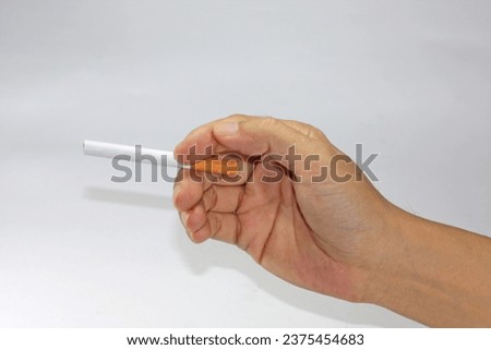 Similar – Image, Stock Photo Hand holding a cigarette