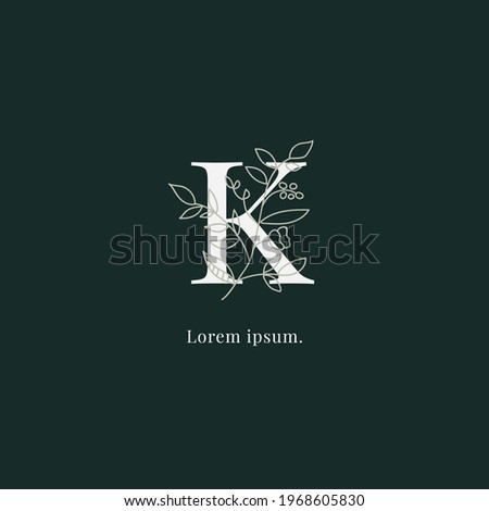 initial K letters monogram logo with leaf and flower vector.