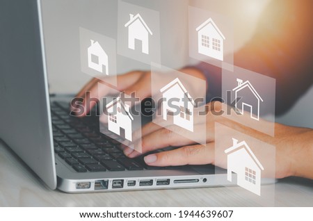 Real estate concept business, home insurance and real estate protection. Buy and sell houses and real estate online on a virtual screen.