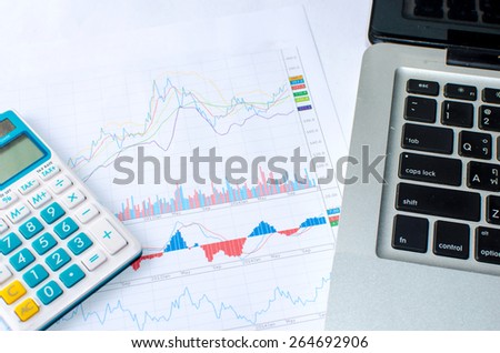 business workplace calculator and printed data sheet