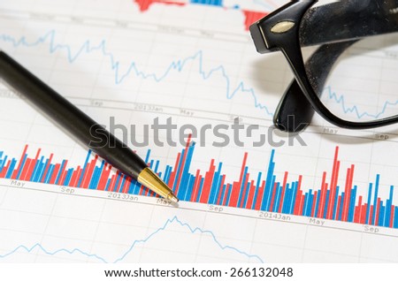 Black pen on finance report
