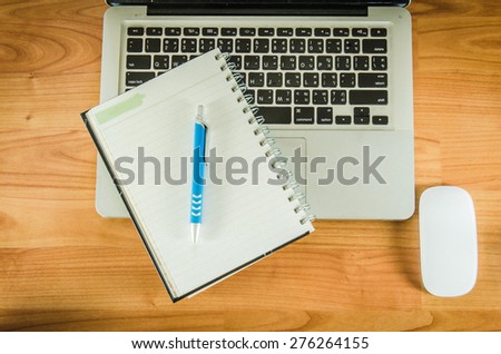 Laptop computer and flower. Top view with copy space