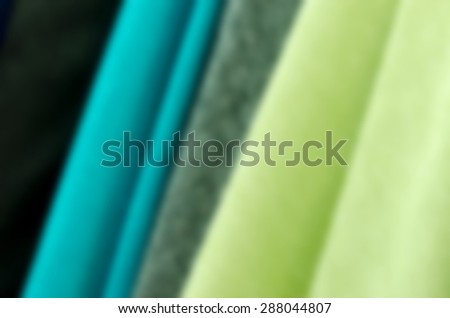 Closeup of various fabric bolts in store.blur background.