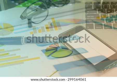 business workplace and computer and printed data sheet