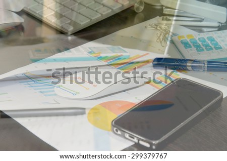 Desk cluttered with business documents