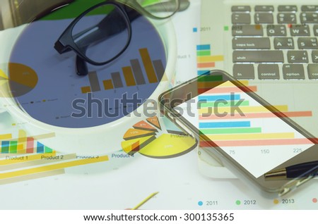 business workplace and computer and printed data sheet