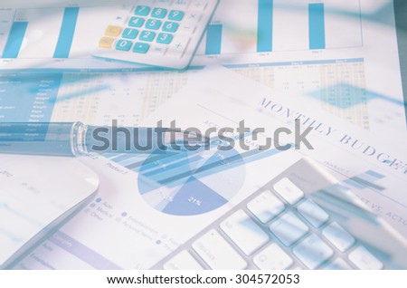 keyboard and pen on finance report.business Concept