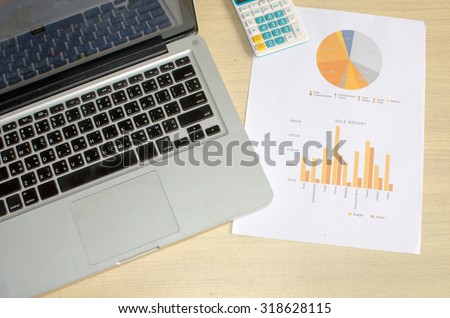 Business documents, computers and graph