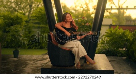 Similar – Image, Stock Photo Positive woman playing guitar in bedroom