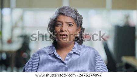 Similar – Image, Stock Photo Serious woman looking at camera