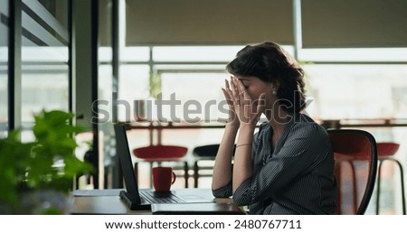 Similar – Image, Stock Photo woman sits annoyed in her living room and has a laughing smiley on her forehead (home office)