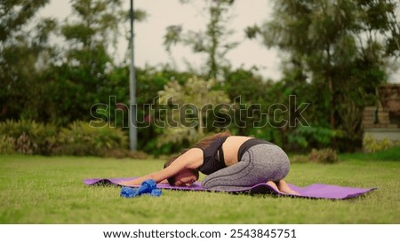 Similar – Image, Stock Photo Positive Asian sportswoman leaning on barbell in modern gym and looking at camera