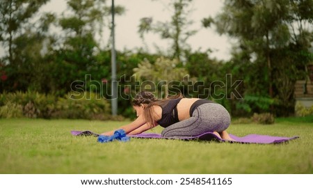 Similar – Image, Stock Photo Positive Asian sportswoman leaning on barbell in modern gym and looking at camera