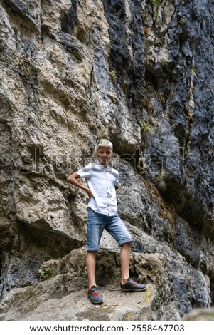 Similar – Foto Bild Auf Stein stehender Junge mit VR-Brille gegen Berg