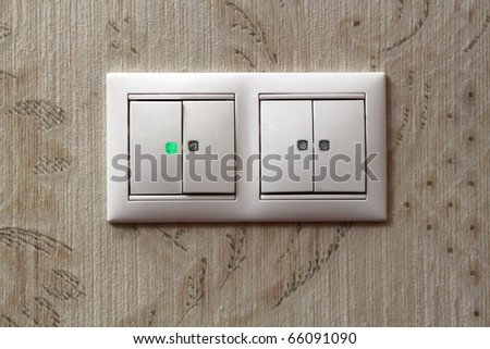 Two light switches on  wall