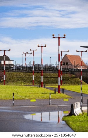 Similar – Image, Stock Photo red-white barrier beacons in front of a richly decorated but slowly decaying residential house with yellow-brown clinker facade from the Gründerzeit / dilapidated / lost place