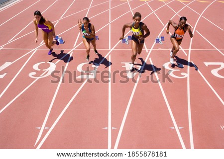 Image, Stock Photo Young focused ethnic sportswoman on street before training