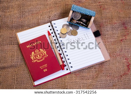 A travel concept image and this photo have passport,money coins and note book with sack background