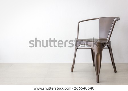 vintage brown iron or metal chair on soft gray color background