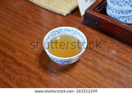 japanese teacup with green tea in an old traditional japanese house