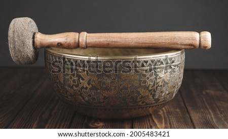 Beautiful tibetan singing bowl with stick on itself Stock foto © 