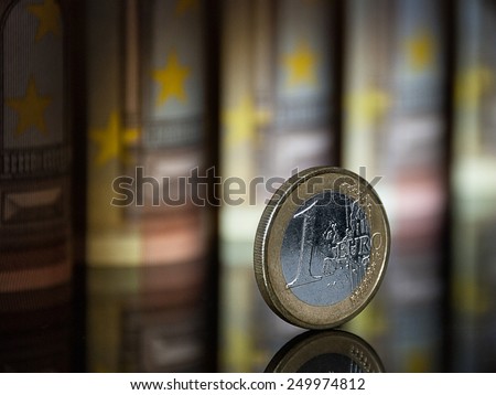 One euro, which is located among many banknotes of Europe