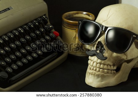 Skull with Hipster glasses, typewriter and a cup of coffee
