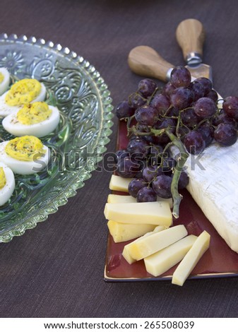 Deviled Eggs, Cheese and Grapes served for a dinner party