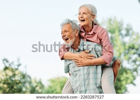 Similar – Image, Stock Photo Loving couple embracing on sofa at home