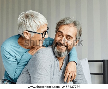 Similar – Image, Stock Photo Happy senior couple embracing in their home