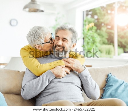 Similar – Image, Stock Photo Happy senior couple embracing in their home