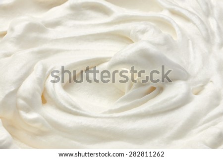 close up of  a white whipped or sour cream on white background