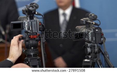 close up of conference meeting and broadcasting camera