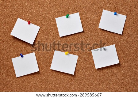 note papers on a cork board