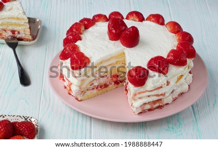 homemade strawberry cake cut. Strawberry pie decorated with fresh strawberries stands on a plate. Ice cream and strawberry cream. Cut off a piece. High quality photo