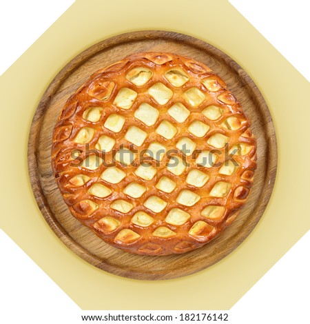 Wooden dish with cheese pie. Isolated image with white background. View from above. still life of setout table Russian cuisine