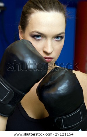 Portrait of the beautiful woman with box gloves.